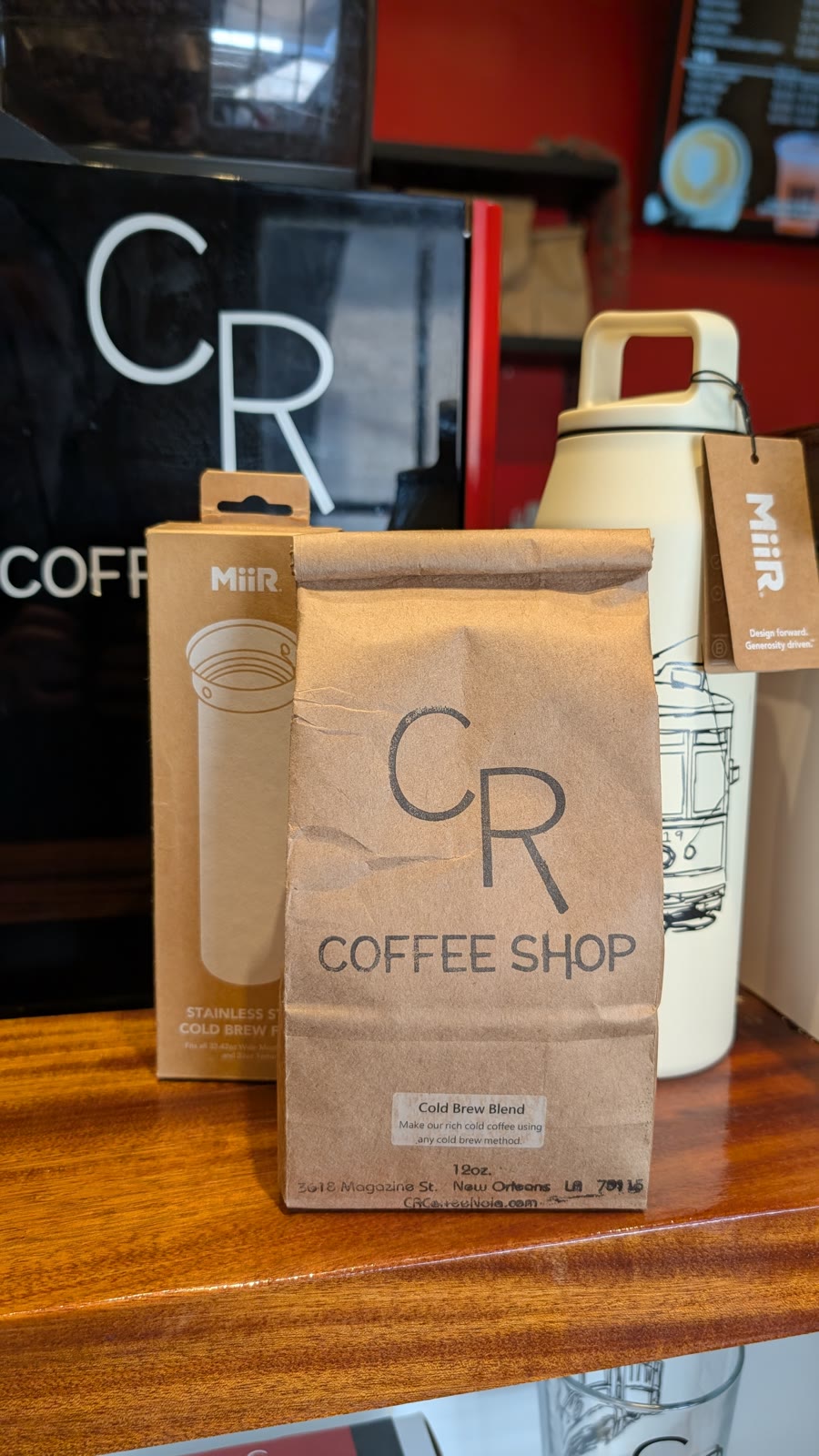 CR coffee bags and streetcar bottles on the retail wall inside the Magazine Street shop